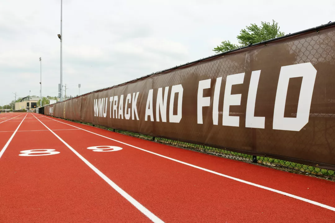 Custom fence scrim that says 'WMU Track and Field'