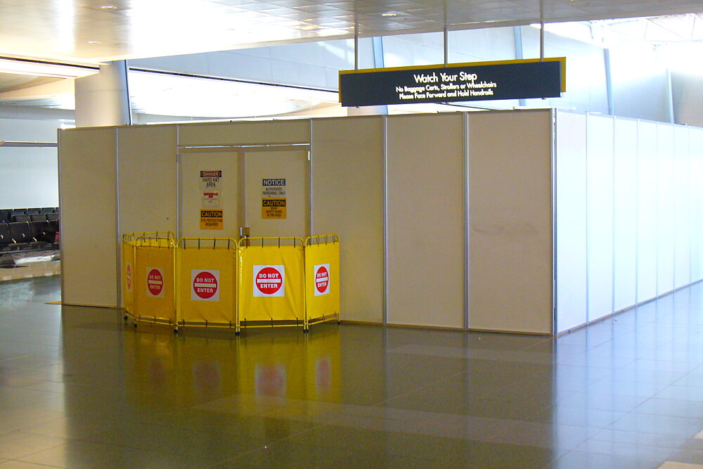 Temporary barricade walls for construction inside of an airport