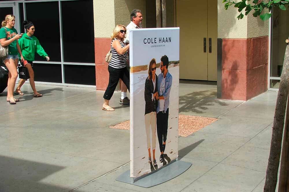 A custom banner standee in a shopping center