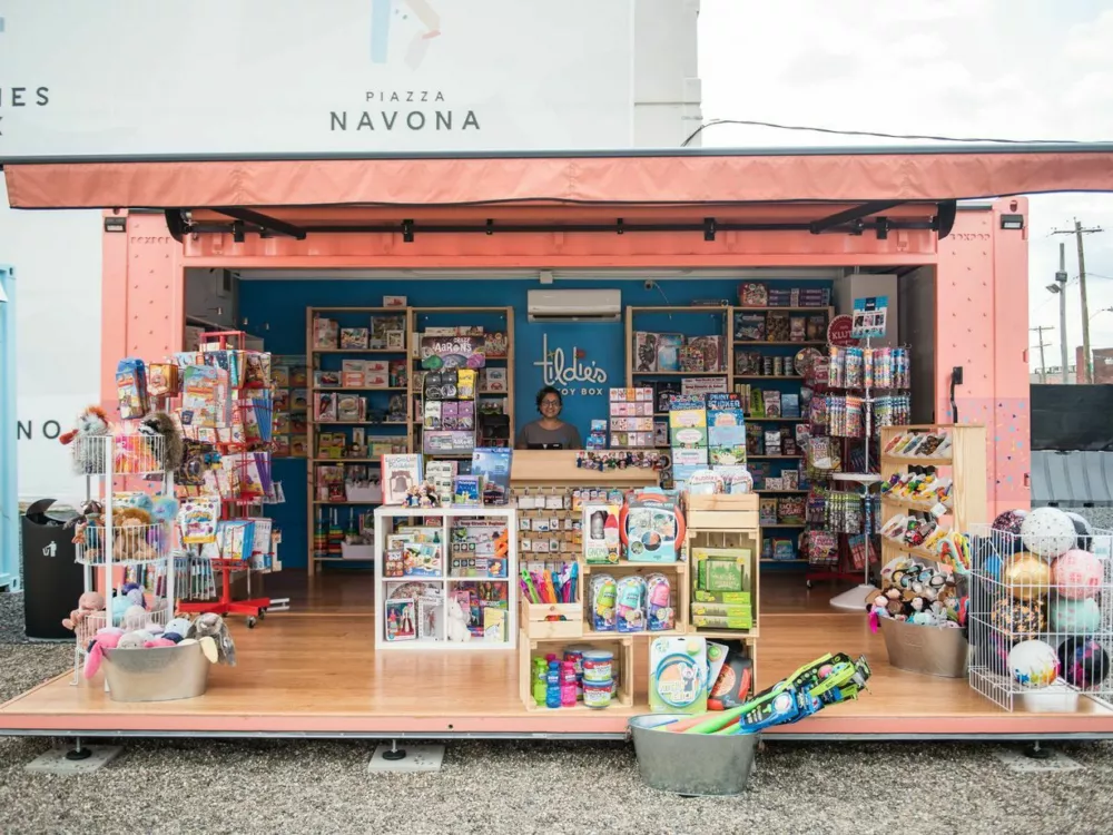 A custom shipping container being used as a retail space for books