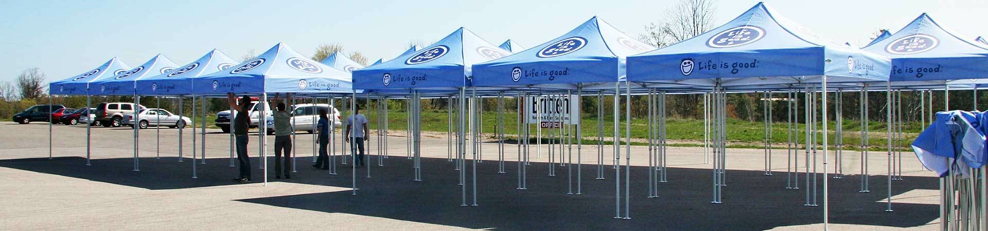 Custom printed tents with sponsor logo on top.