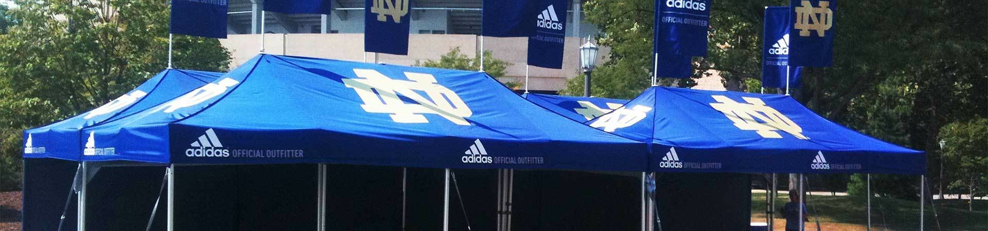 Large custom printed tents with university logo on top.