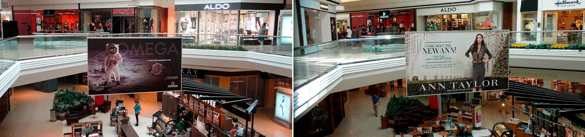 Remote controlled banner hoists inside of a mall.