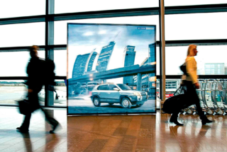 Collapsible Banner Stand With Custom Banner Inside of an Airport