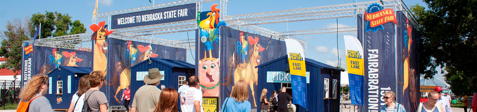 Custom event truss with mesh banners as the entrance at the Nebraska state fair.