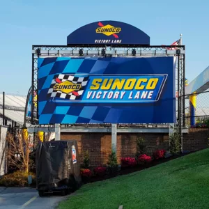 Custom event truss with mesh banner and signage for victory lane.