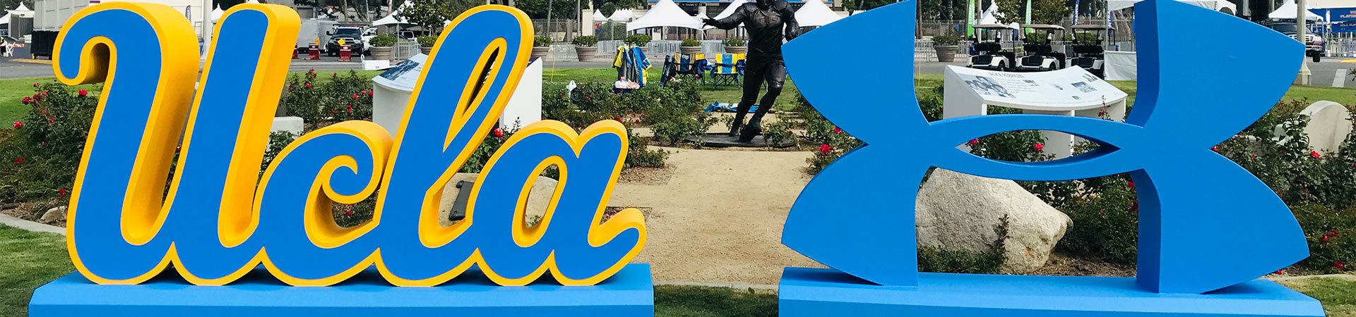 Large foam sculptures of the UCLA abbreviation and under armour logo for student selfies.