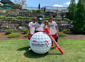 A huge foam 3d golf ball and tee at the Great Lakes Bay Invitational