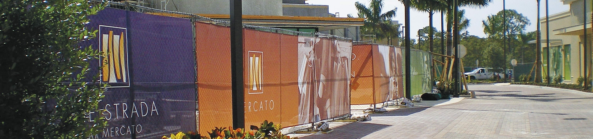 Printed fence graphics to conceal a construction site.